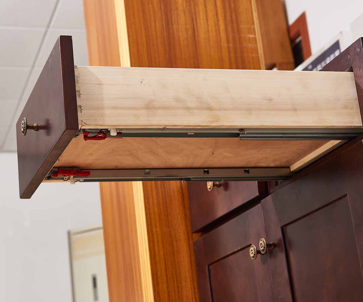 Face frame cabinet drawer slide